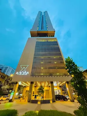 a large building with a tower with lights on it at Axon Residensi Bukit Bintang in Kuala Lumpur