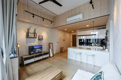 a living room with a kitchen and a bar at Star Residences By Minos Homestay in Kuala Lumpur