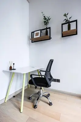 an office with a white desk and a black chair at Star Residences By Minos Homestay in Kuala Lumpur