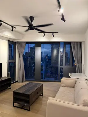 a living room with a couch and a ceiling fan at Star Residences KLCC by Nexus 3A in Kuala Lumpur