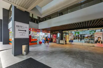 a shopping mall with people walking inside of it at KAĨTE Suites at Wisma Cosway Sky Bridge to Pavilion KL in Kuala Lumpur
