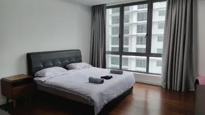 a bedroom with a bed and a large window at KL29 3BR4B Jalan Ampang Near KLCC in Kuala Lumpur