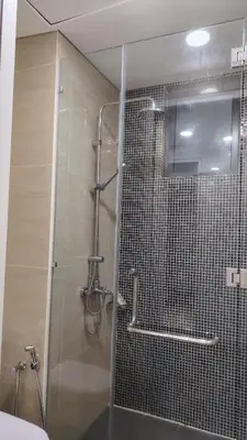 a shower with a glass door in a bathroom at KL29 3BR4B Jalan Ampang Near KLCC in Kuala Lumpur