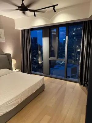 a bedroom with a bed and a large window at KL Star Residences KLCC By Nexus 38 in Kuala Lumpur