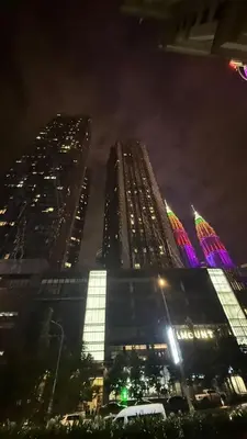 two tall buildings in a city at night at KL Star Residences KLCC By Nexus 38 in Kuala Lumpur