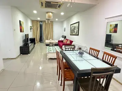 a living room with a table and chairs and a couch at Taragon Luxury Suites Bukit Bintang,Kuala Lumpur in Kuala Lumpur