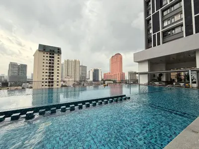 a large swimming pool on top of a building at Chambers Suites Kuala Lumpur by AFA in Kuala Lumpur