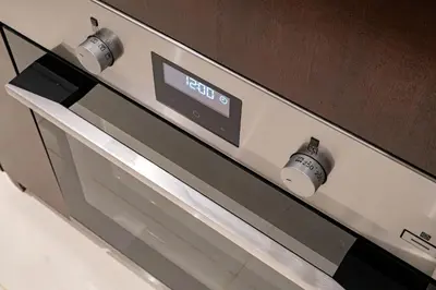 a close up of a stove top oven at La Gente x Novo Ampang 3R3B Duplex Penthouse in Kuala Lumpur