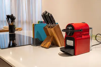 a red toaster sitting on top of a table at La Gente x Novo Ampang 3R3B Duplex Penthouse in Kuala Lumpur