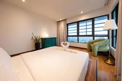 a bedroom with a bed with a stuffed rabbit on it at La Gente x Novo Ampang 3R3B Duplex Penthouse in Kuala Lumpur