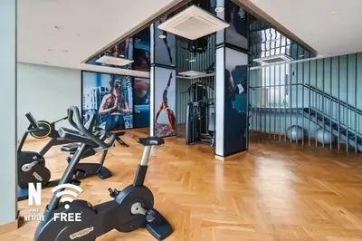 a gym with a treadmill and a exercise bike at Mont Kiara Ooak Suite Sunway 163 with Bathtub 2 Bed in Kuala Lumpur