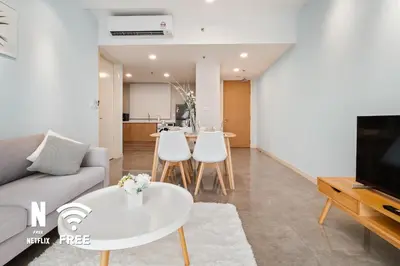a living room with a couch and a table at Mont Kiara Ooak Suite Sunway 163 with Bathtub 2 Bed in Kuala Lumpur