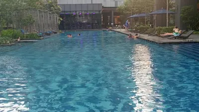 a group of people in a swimming pool at Star klcc by AR Accommodation in Kuala Lumpur