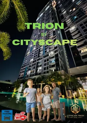 a group of children standing in front of a tall building at Cityscape Retreat TRION KL Premium Suites in Kuala Lumpur