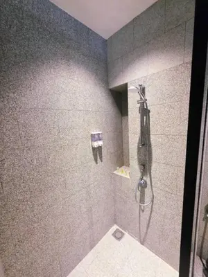 a bathroom with a shower and a toilet at Scarletz KLCC By AR Hospitality in Kuala Lumpur