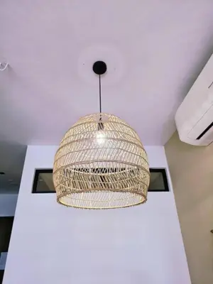 a rattan light hanging from a ceiling at Scarletz KLCC By AR Hospitality in Kuala Lumpur