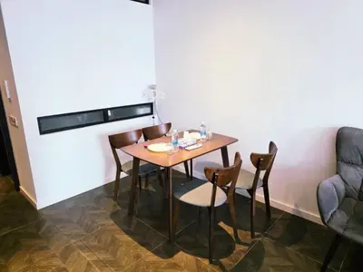 a dining room with a table and chairs at Scarletz KLCC By AR Hospitality in Kuala Lumpur