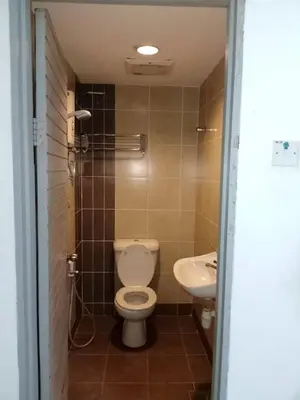 a bathroom with a toilet and a sink at J Hotel Bukit Bintang in Kuala Lumpur