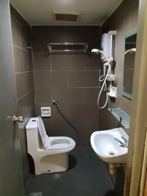 a bathroom with a toilet and a sink at J Hotel Bukit Bintang in Kuala Lumpur