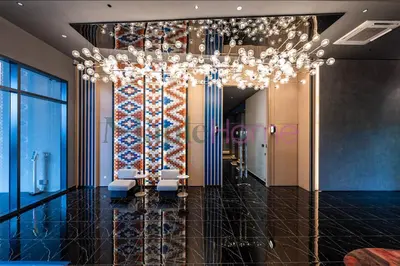 a lobby with a chandelier in a building at Majestic Residence Premier Suites Kuala Lumpur in Kuala Lumpur