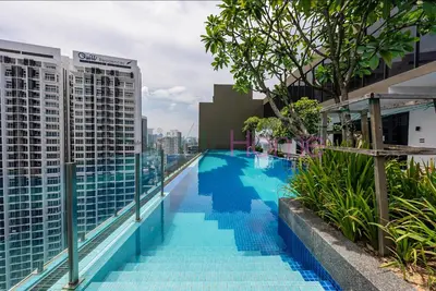 a swimming pool on the roof of a building at Majestic Residence Premier Suites Kuala Lumpur in Kuala Lumpur