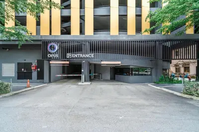 an empty parking lot in front of a building at Blueground Kuala Lumpur pool nr Lake Gardens KUL-1 in Kuala Lumpur