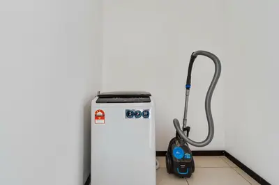 a water heater in a room with a vacuum at Blueground Kuala Lumpur pool nr Titiwangsa Park KUL-4 in Kuala Lumpur