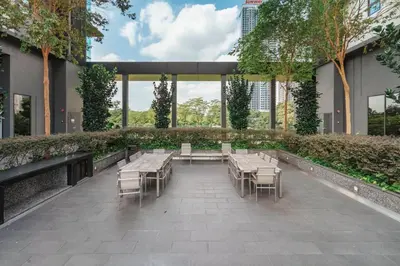 a courtyard with tables and chairs in a building at Blueground Kuala Lumpur pool nr Titiwangsa Park KUL-4 in Kuala Lumpur