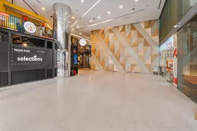 a shopping mall with a white tile floor in a mall at Blueground Kuala Lumpur pool nr KL Tower KUL-5 in Kuala Lumpur