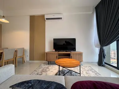 a living room with a flat screen tv on a table at Majestic Residence KLCC By AFA in Kuala Lumpur