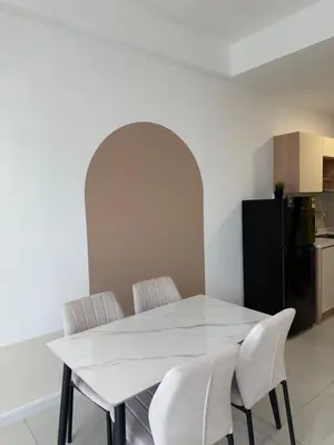 a white dining table with white chairs in a kitchen at Majestic Residence KLCC By AFA in Kuala Lumpur