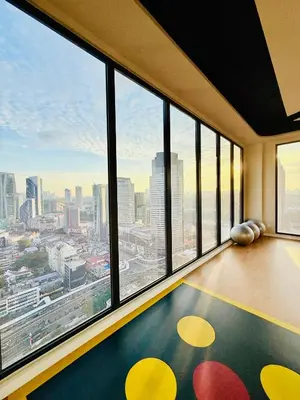 a room with a large window with a view of a city at Majestic Residence KLCC By AFA in Kuala Lumpur