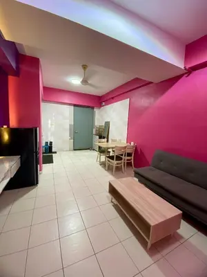 a living room with a couch and a table at nuvea Suites in Kuala Lumpur