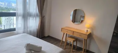 a small bedroom with a bed and a mirror at Agile Twilight Residence Apartment in Kuala Lumpur