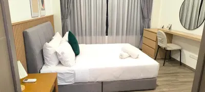 a hotel room with a bed and a desk at Agile Twilight Residence Apartment in Kuala Lumpur