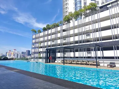 a building with a swimming pool in front of a building at 01 Kuala Lumpur KL Mid Valley The Garden 9Seputeh Vivo Soho 2PAX in Kuala Lumpur