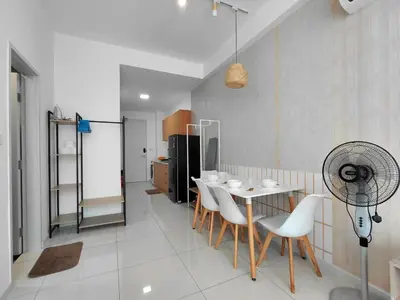 a dining room with a table and chairs and a fan at KLCC Modern Stay, Majestic Residence, 2-5Pax in Kuala Lumpur
