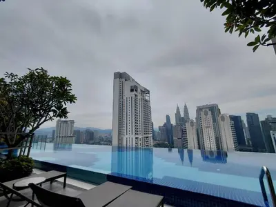 a swimming pool with a view of a city at KLCC Modern Stay, Majestic Residence, 2-5Pax in Kuala Lumpur