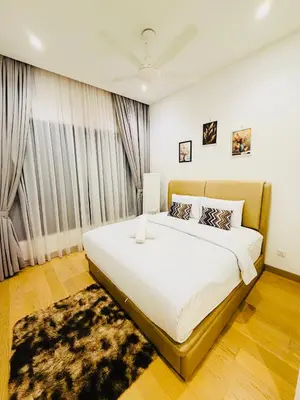 a bedroom with a large bed in a room at Lucentia Cozy Comfort Infinity Pool Suites in Kuala Lumpur