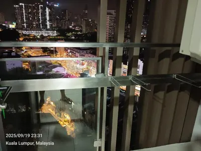 a view of a city at night from the top of a building at Sentral Residency KL sentral in Kuala Lumpur