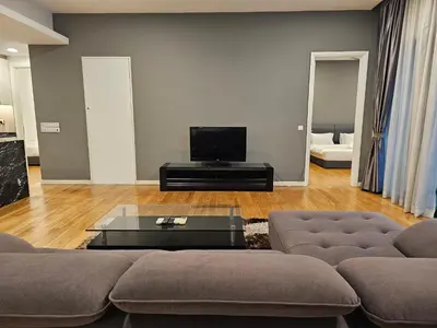 a living room with a couch and a tv at Cozy Spacious Loft St Mary Bukit Bintang Pavilion in Kuala Lumpur