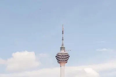 a view of the sydney tower against a cloudy sky at Luxury Living Hostel in Kuala Lumpur