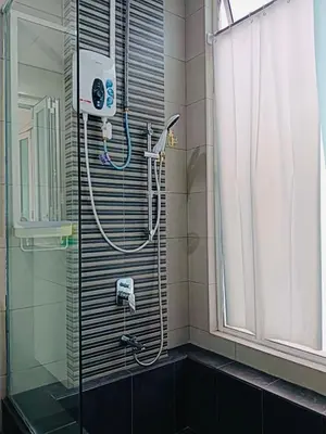a shower in a bathroom with a glass door at Setapak Central Mall Zetapark Home Sweet Home 2 in Kuala Lumpur