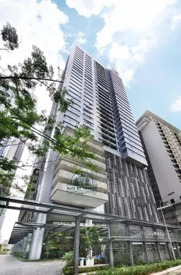 a tall building with a sign on the front of it at Kuala Lumpur City Center By Summer Suites in Kuala Lumpur