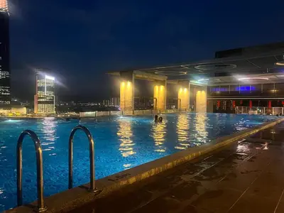 a large swimming pool in a city at night at Super Tang Jaya in Kuala Lumpur