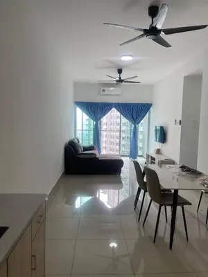 a living room with a couch and a table at Warm & Spacious 2BR Apartment in Kuala Lumpur