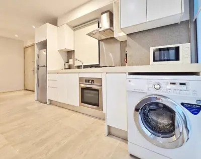 a kitchen with a washing machine in a kitchen at Kuala Lumpur Bintang Fairlane #107 TRX Pavilion KL in Kuala Lumpur