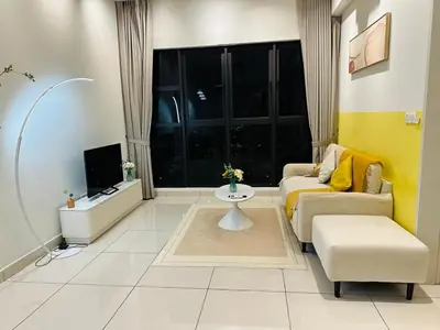 a living room with a couch and a tv at Trion Homestay -KL in Kuala Lumpur