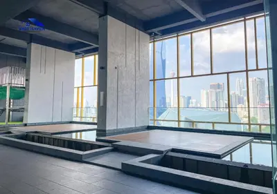 a room with large windows and a view of the city at OPUS Residences Kuala Lumpur by VastHaven in Kuala Lumpur
