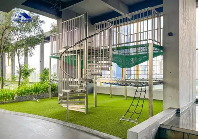 a playground with a swing in a building at OPUS Residences Kuala Lumpur by VastHaven in Kuala Lumpur